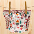 Culla di Teby Höschenwindel mit Pocketfunktion im Design Childhood auf der Wäscheleine