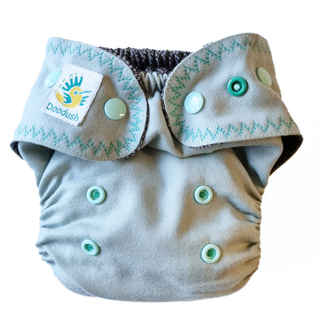Doodush Wollüberhose im Design Mint Cloud in Mintgrün