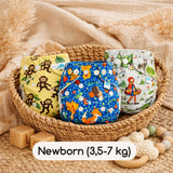 Drei Little Clouds Überhosen in Newborn-Größe (3,5–7 kg) in einem geflochtenen Korb