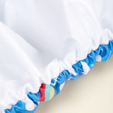 TotsBots Bamboozle Wrap (PeeNut V2.0) Überhose Newborn (2,5–8 kg) im Design Rainbow Skies, Detailansicht